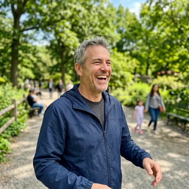 Man in his fifties smiling outdoors
